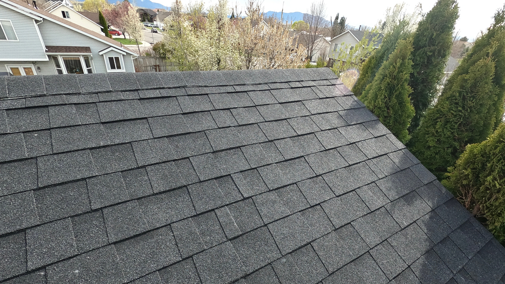Grey,asphalt,shingles,on,roof,of,home.,new,roof,installed