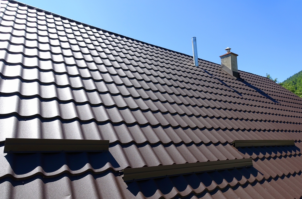 Brown,corrugated,metal,profile,roof,installed,on,a,modern,house.
