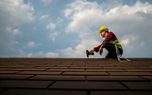 Happy,roof,repair,technician,workers,smiling,and,looking,work,on